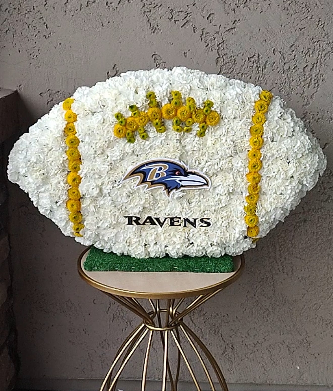 Football floral sympathy arrangement